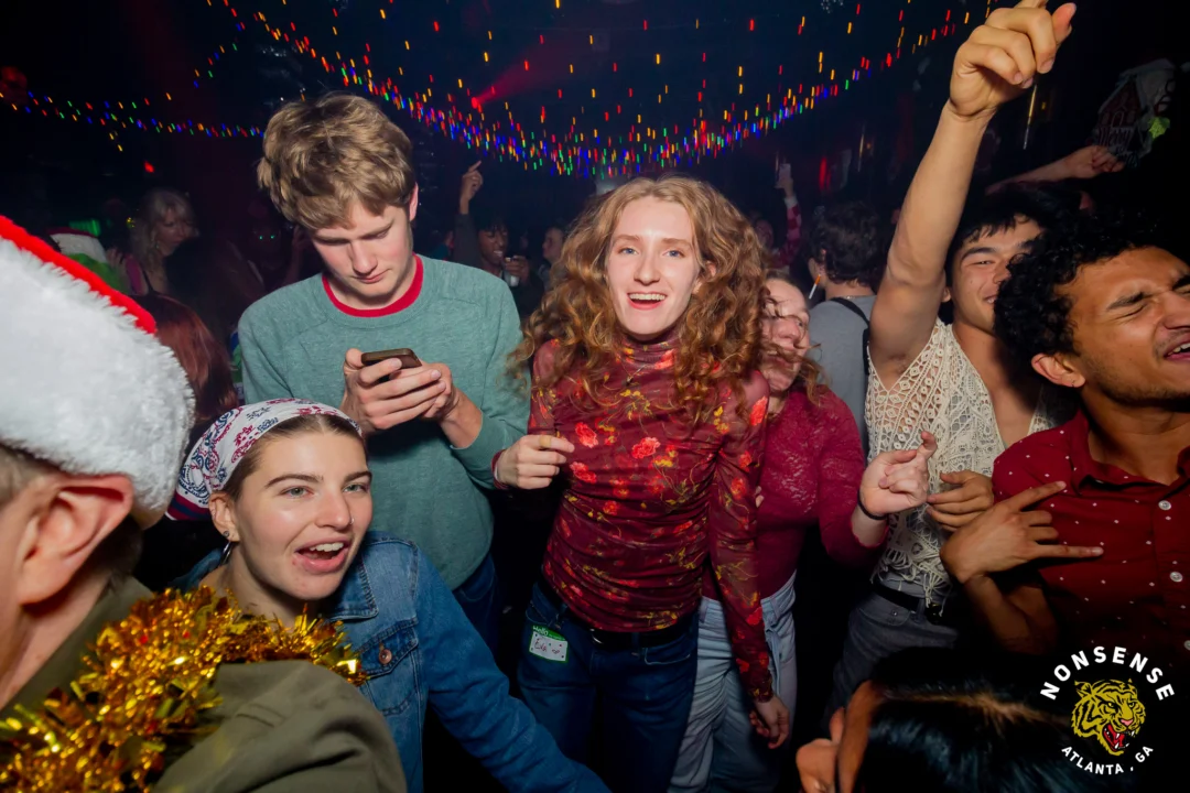 Nonsense Christmas 2025 - Kimber was the DJ - Scott was Santa - Madison was the Grumpy Elf - Photo by @hellacurious