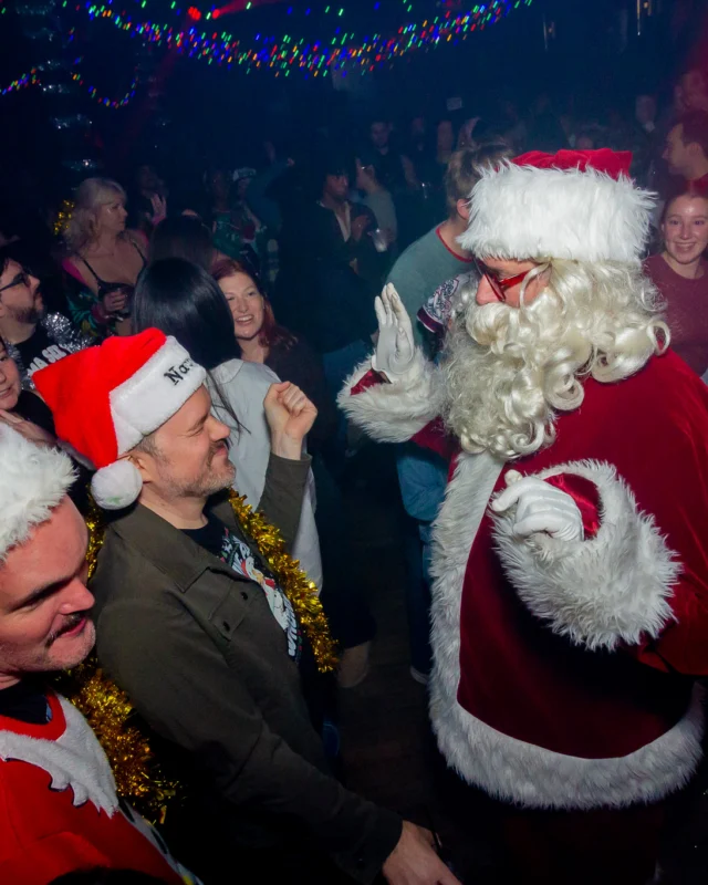 Nonsense Christmas 2025 - Kimber was the DJ - Scott was Santa - Madison was the Grumpy Elf - Photo by @hellacurious